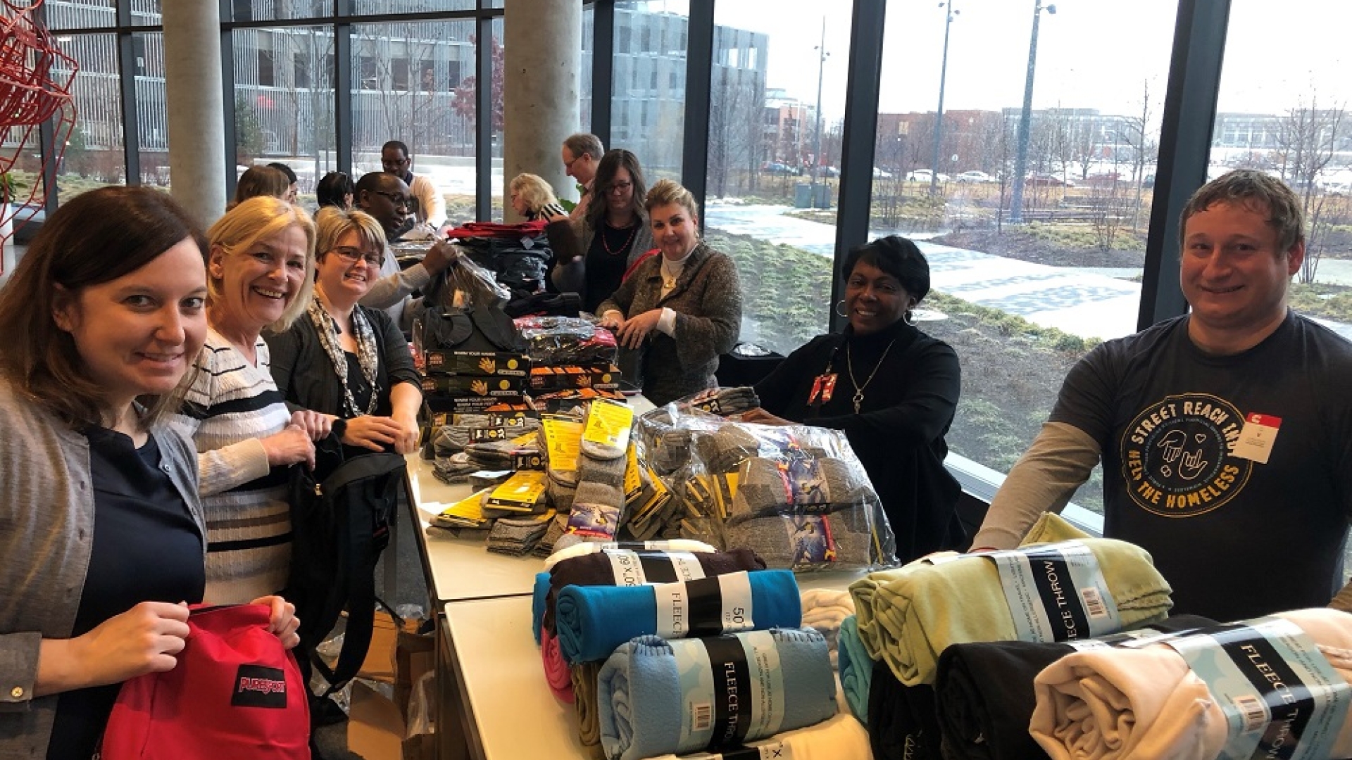 Volunteers assemble winter kits for the homeless in the lobby of Cummins’ Distribution Business Headquarters on the east side of downtown Indianapolis. Volunteers assemble winter kits for the homeless in the lobby of Cummins’ Distribution Business Headquarters on the east side of Indianapolis.