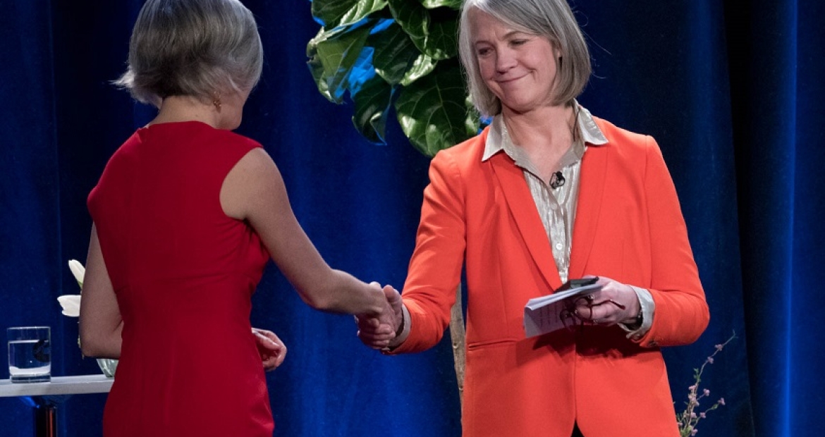 Cummins' Mary Chandler (right) greets Denise Raquel Dunning, founder of Rise Up, at Thursday's announcement.