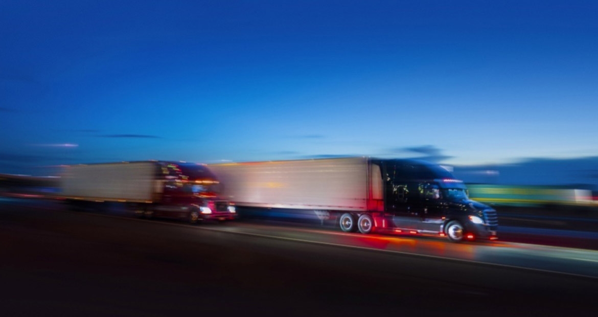 Semi trucks driving on highway