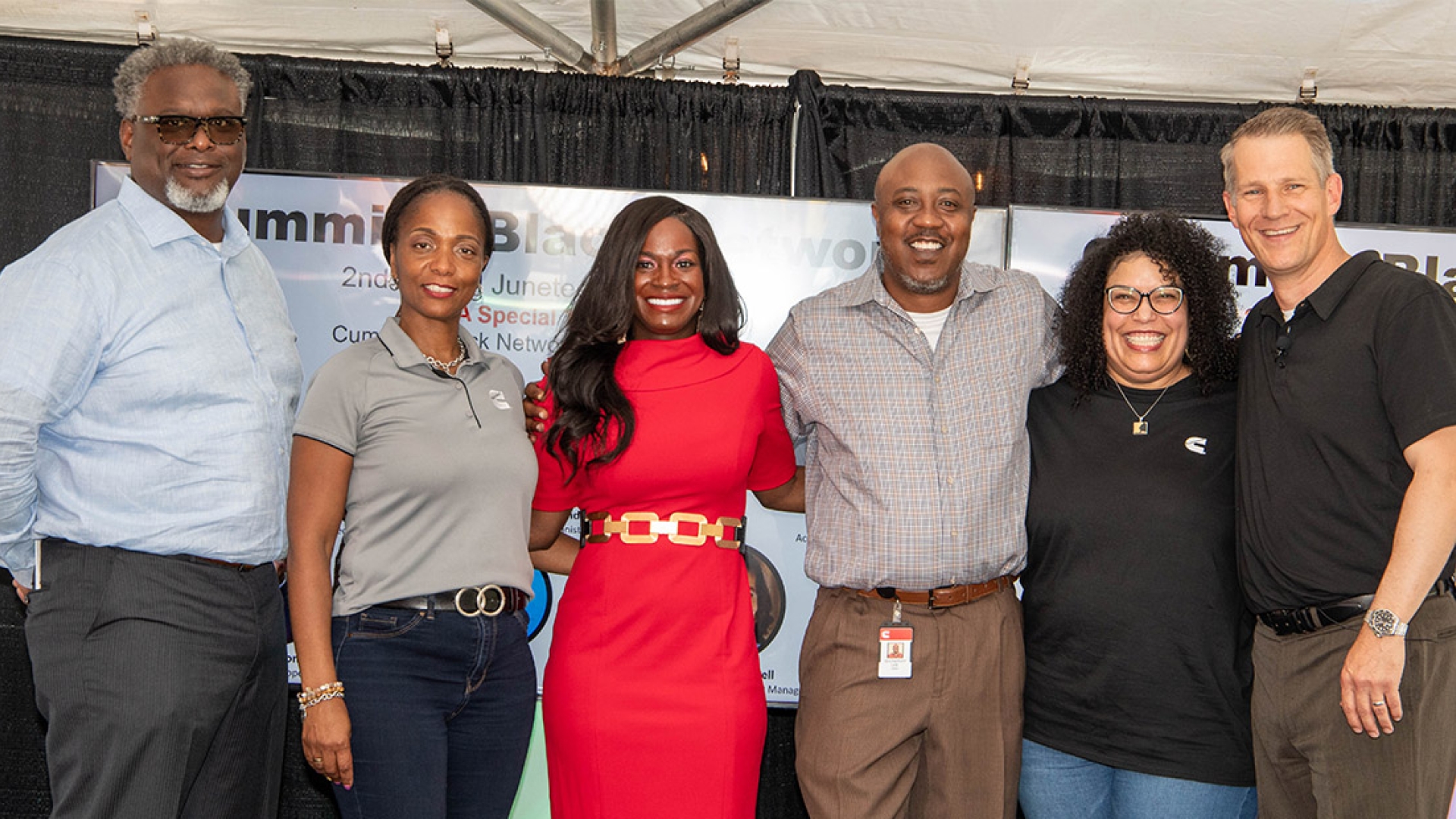 Employees smiling at Juneteenth Jamboree