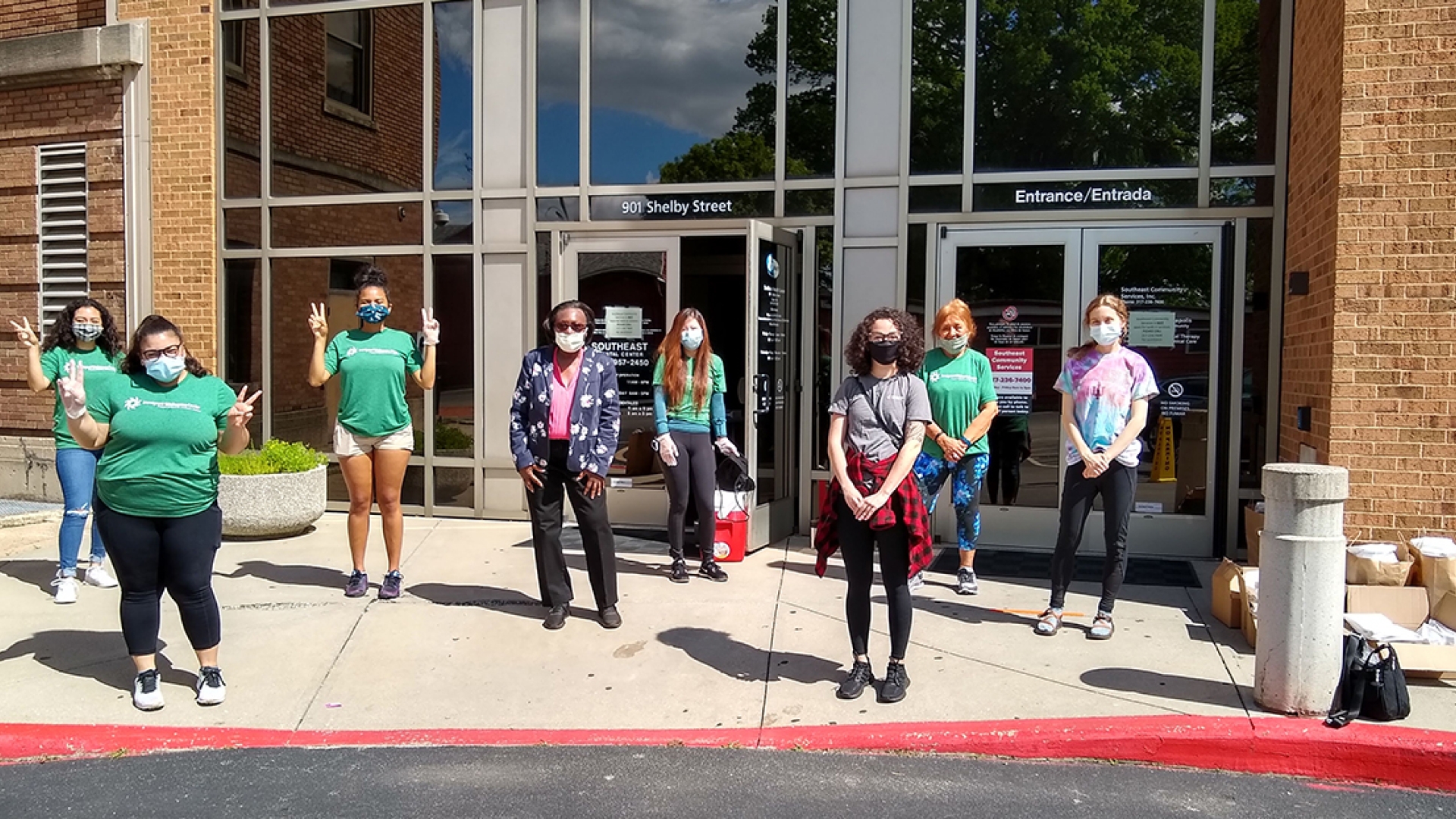 IWC volunteers stand outside its office in Indianapolis, Indiana Immigrant Welcome Center