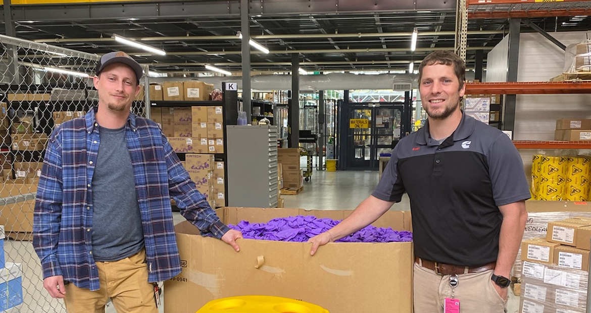 employees in front of gloves