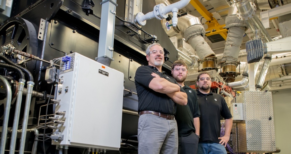 Cummins teams like this one in Seymour, Indiana (USA) are using regenerative dynamometers (behind them) to capture the energy generated testing engines to help power to the company’s plants.