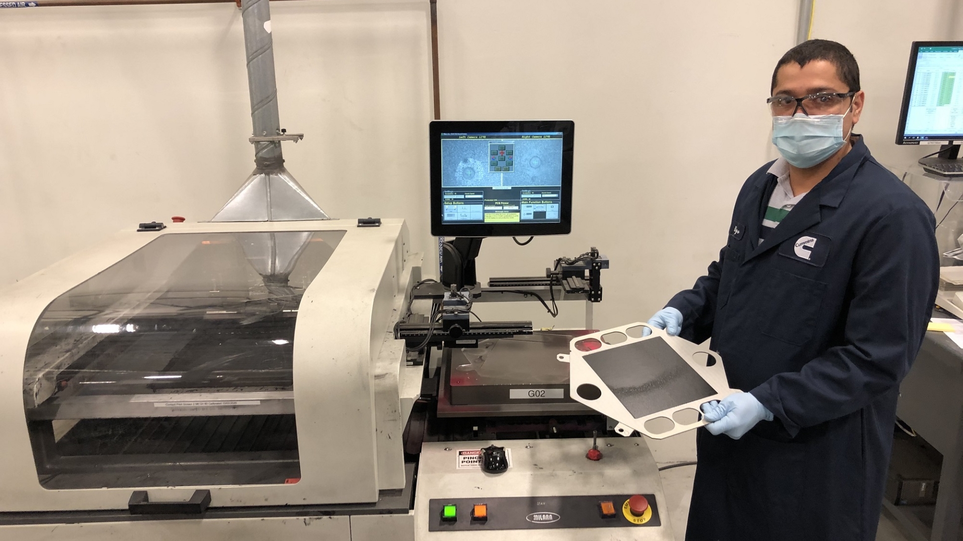A Cummins employee works on the cathode screen printing process, towards the end of the solid oxide fuel cell manufacturing line at the company's facility in Malta, New York (U.S.).