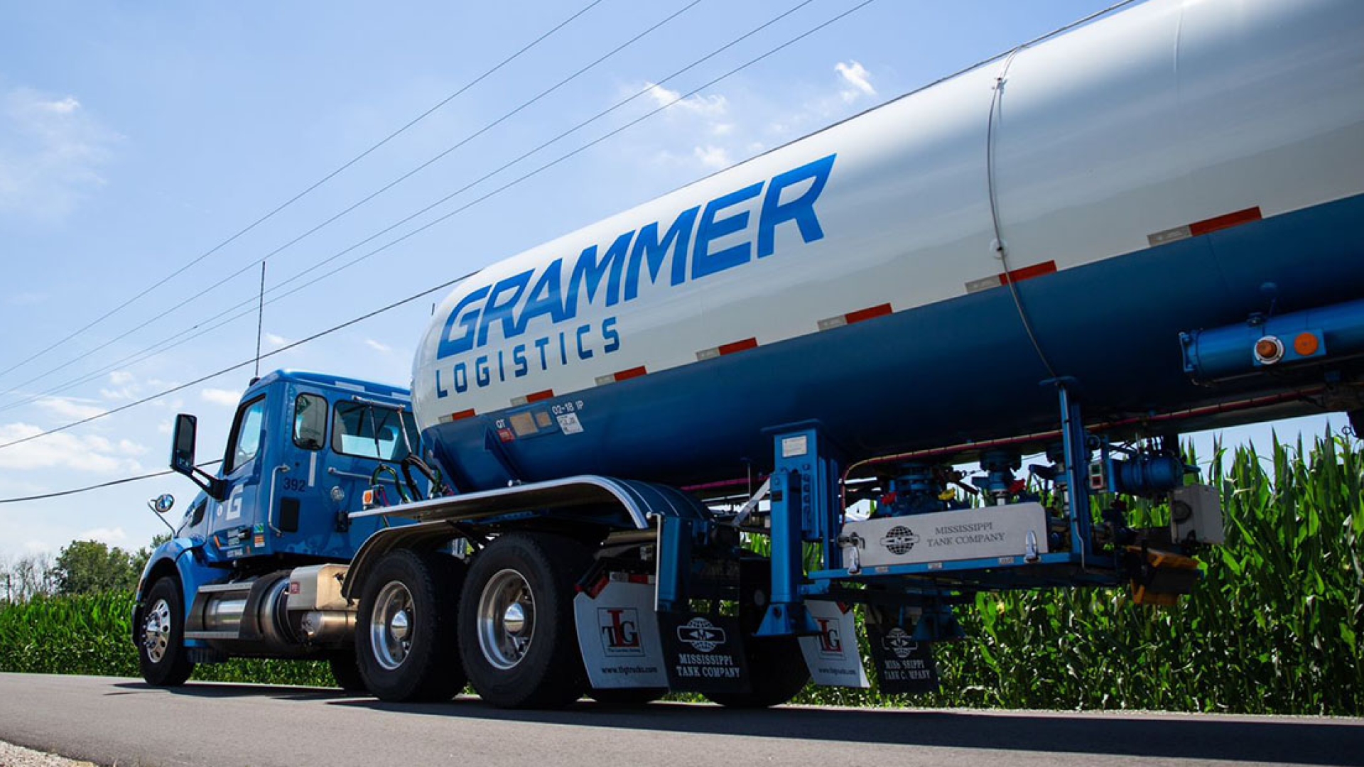 white semi with blue Grammer logo