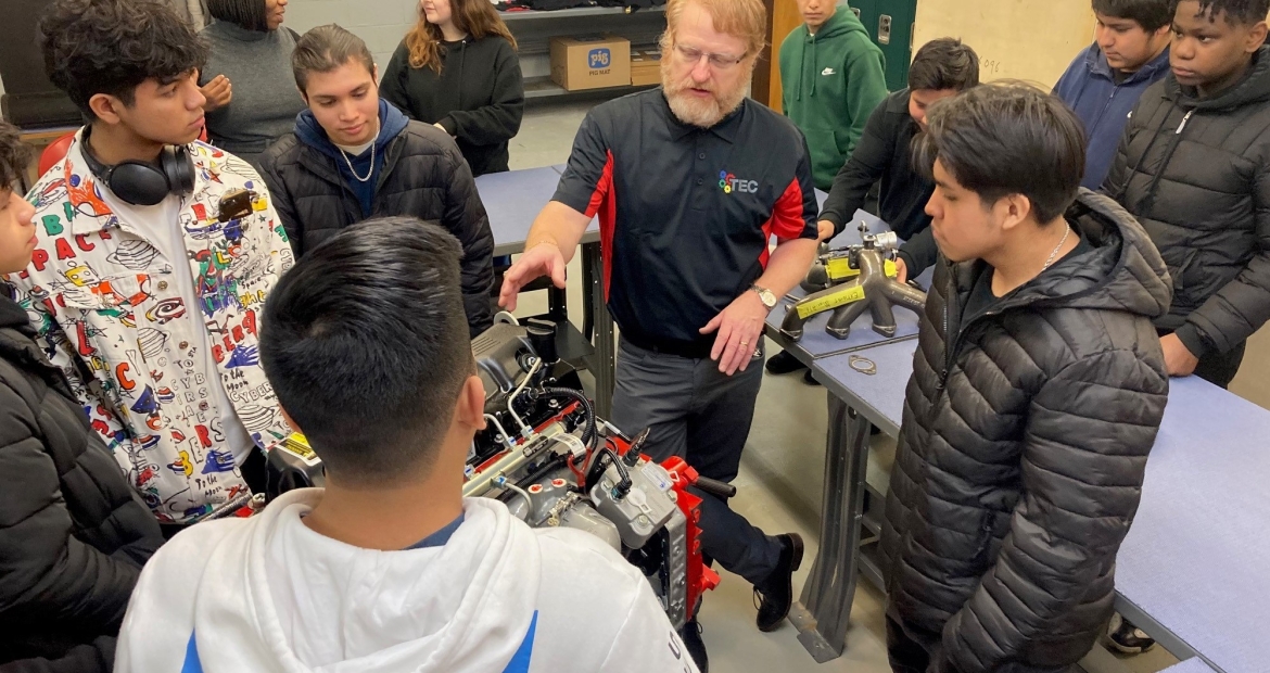 Cummins TEC Director, Jason Irvin describes compontes of a Cummins engine to students looking to sign up for the new Cummins TEC program at Arsenal Technical High School in Indianapolis (U.S.)