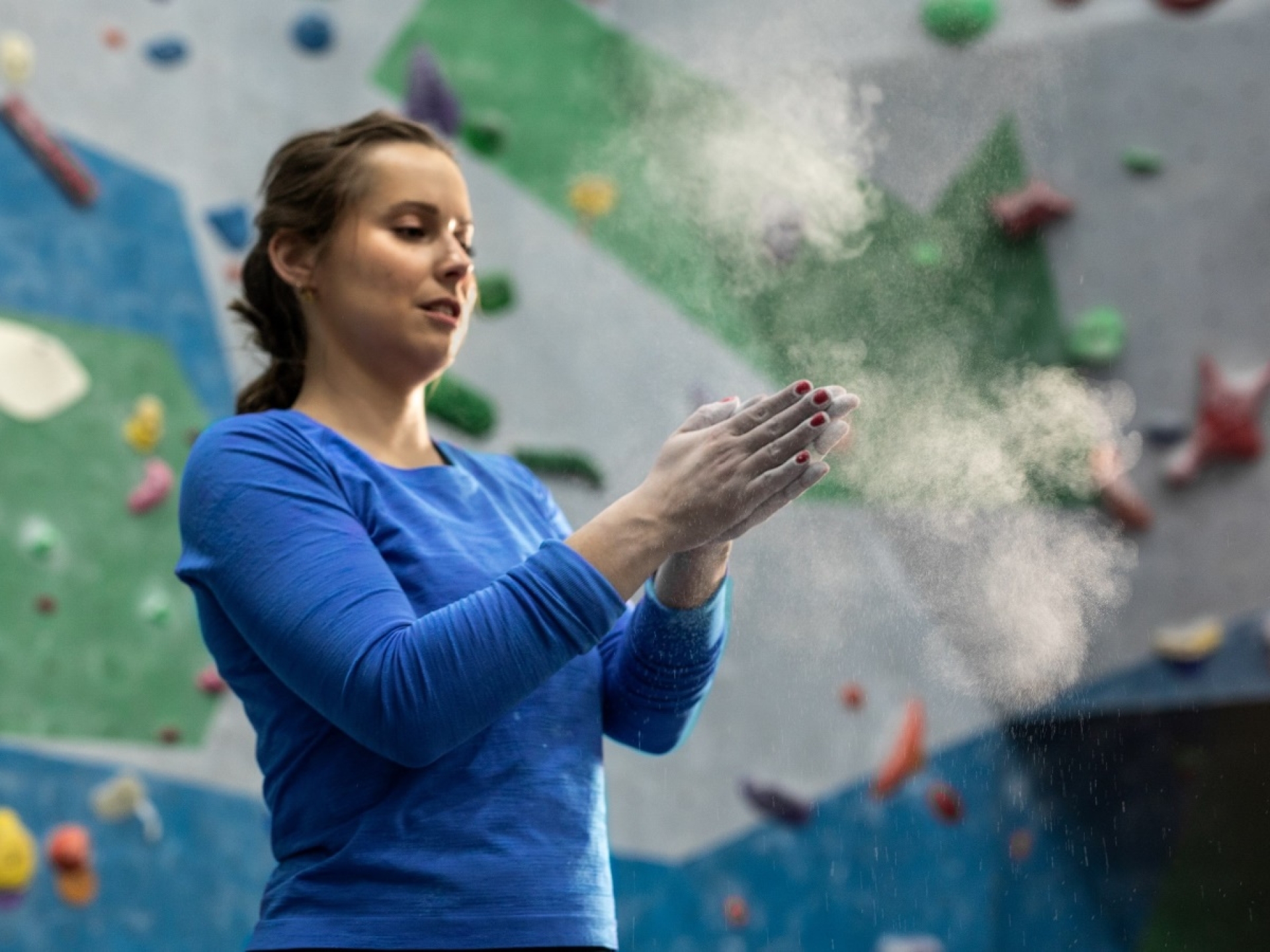 rock climber with chalk on hands