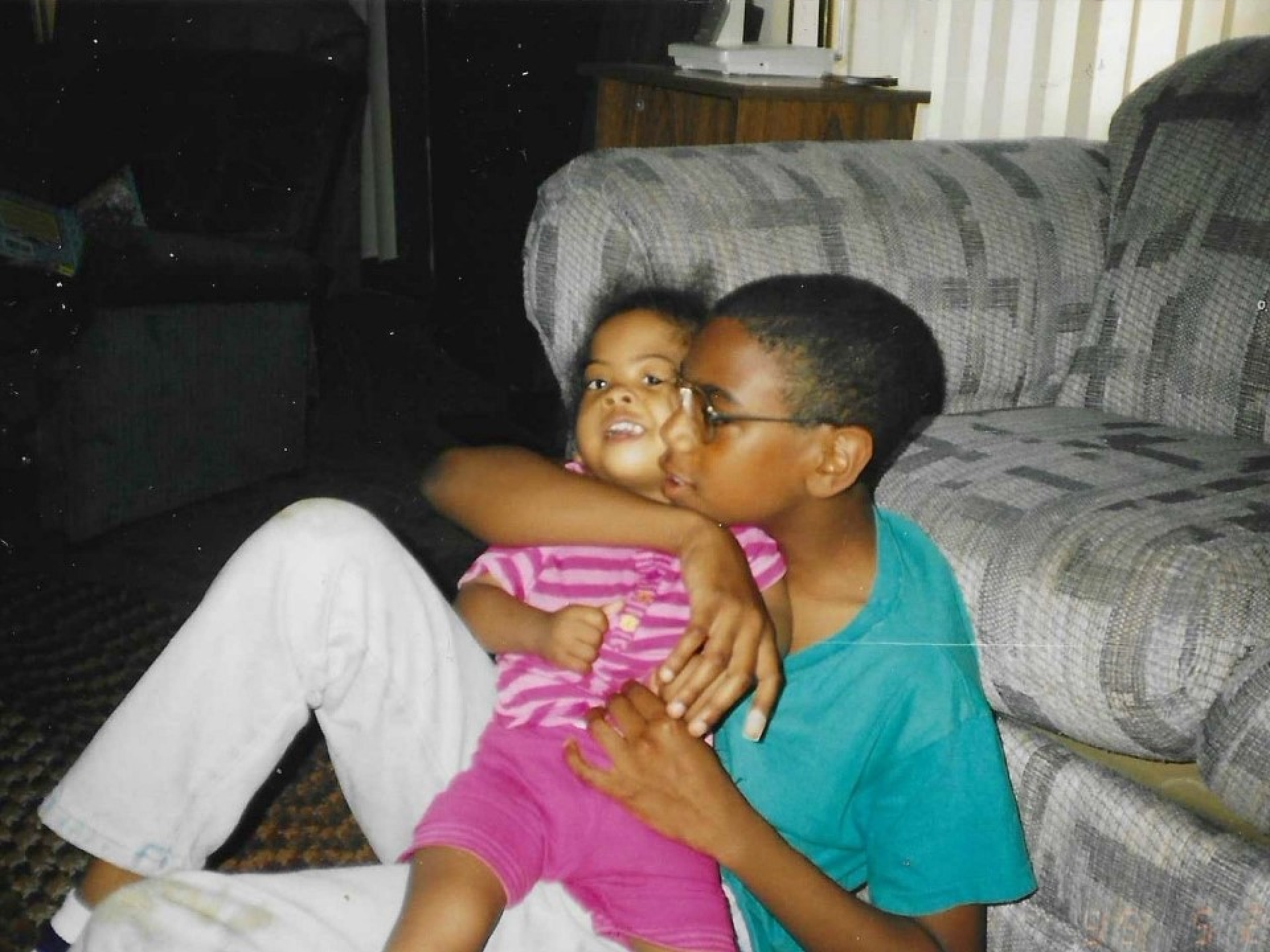 Younger shavonn with her sibling in their living room