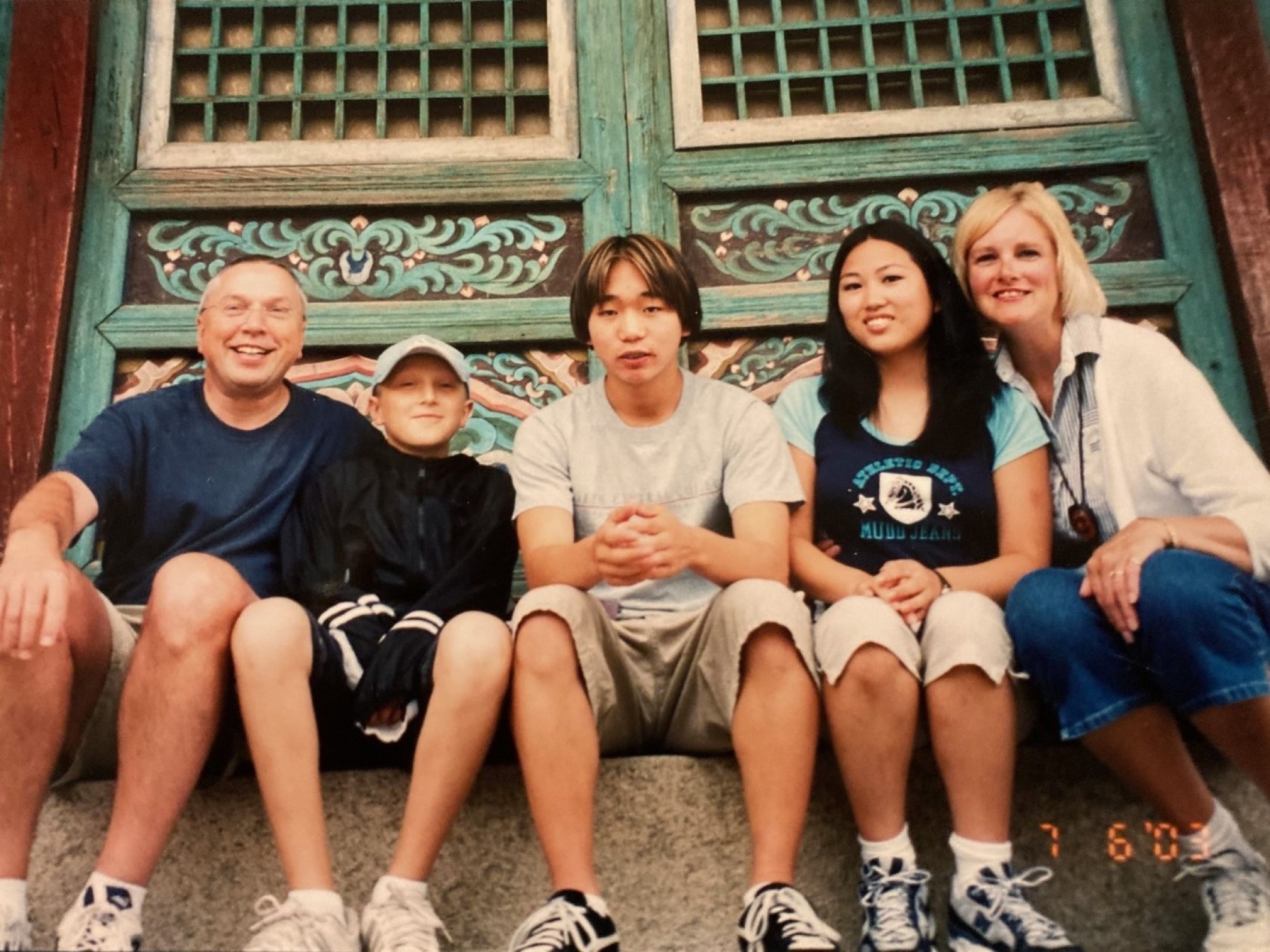 family sitting together for photo
