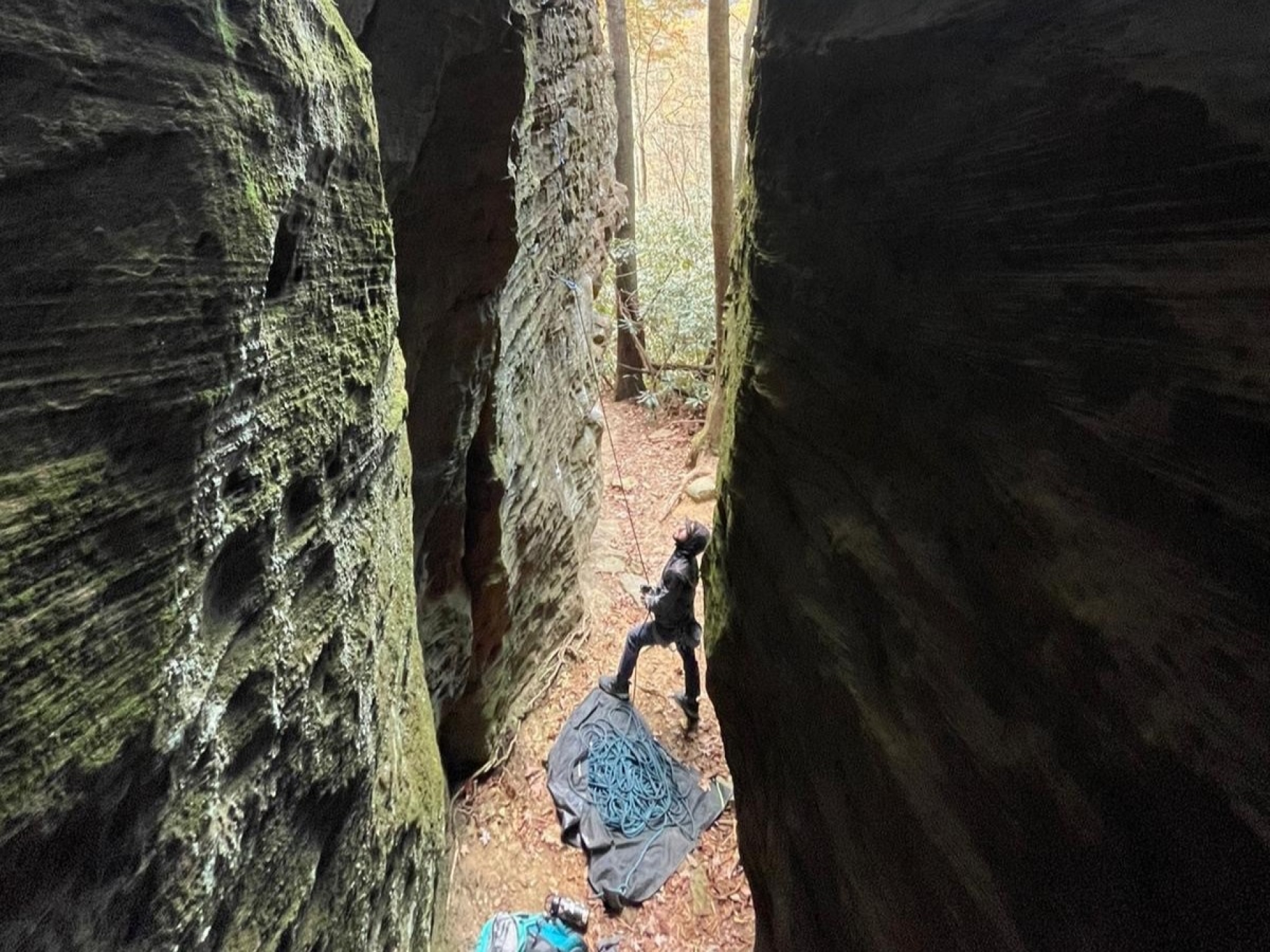 person looking up at canyon wall to rock climb