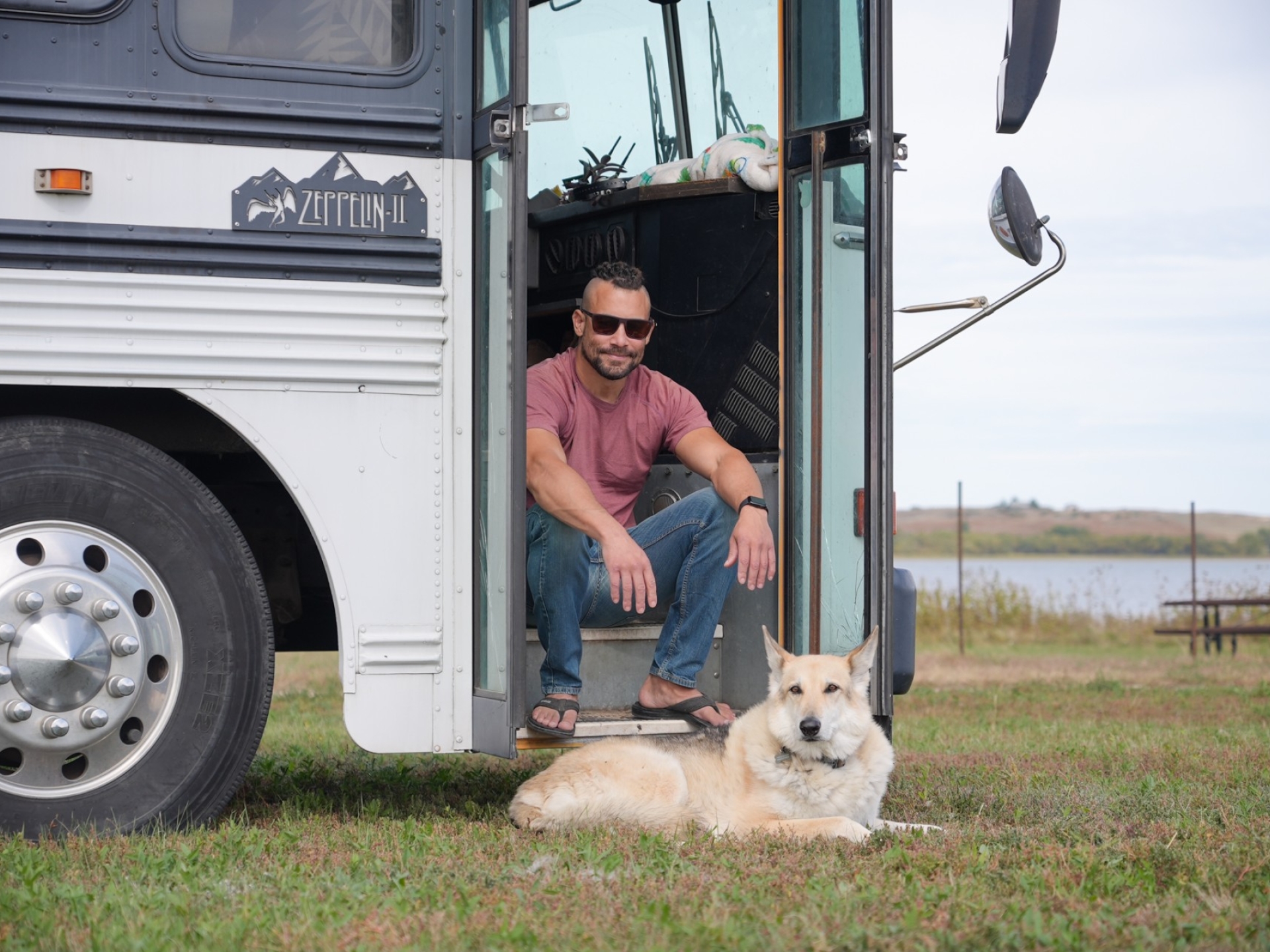 chris_with_his_dog_and_bus_sitting_in_bus_entrance