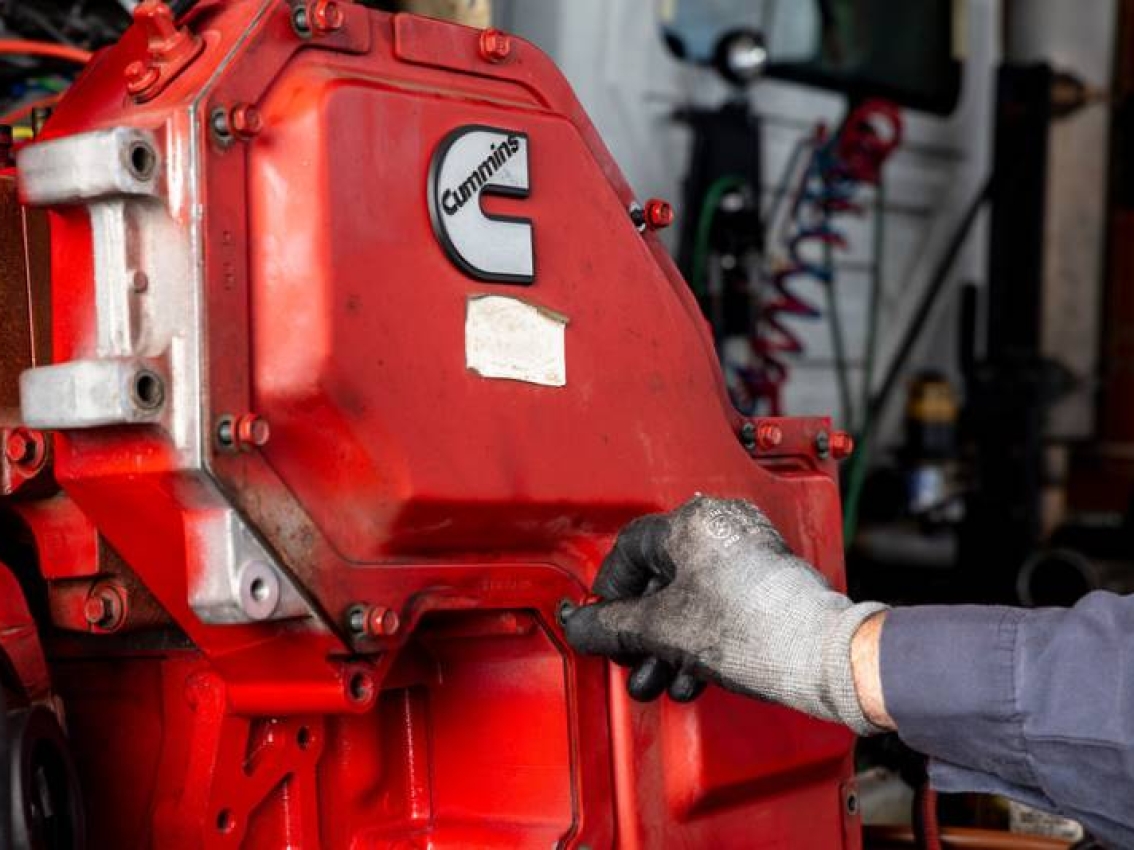 technician adjusting engine parts technician adjusting engine parts