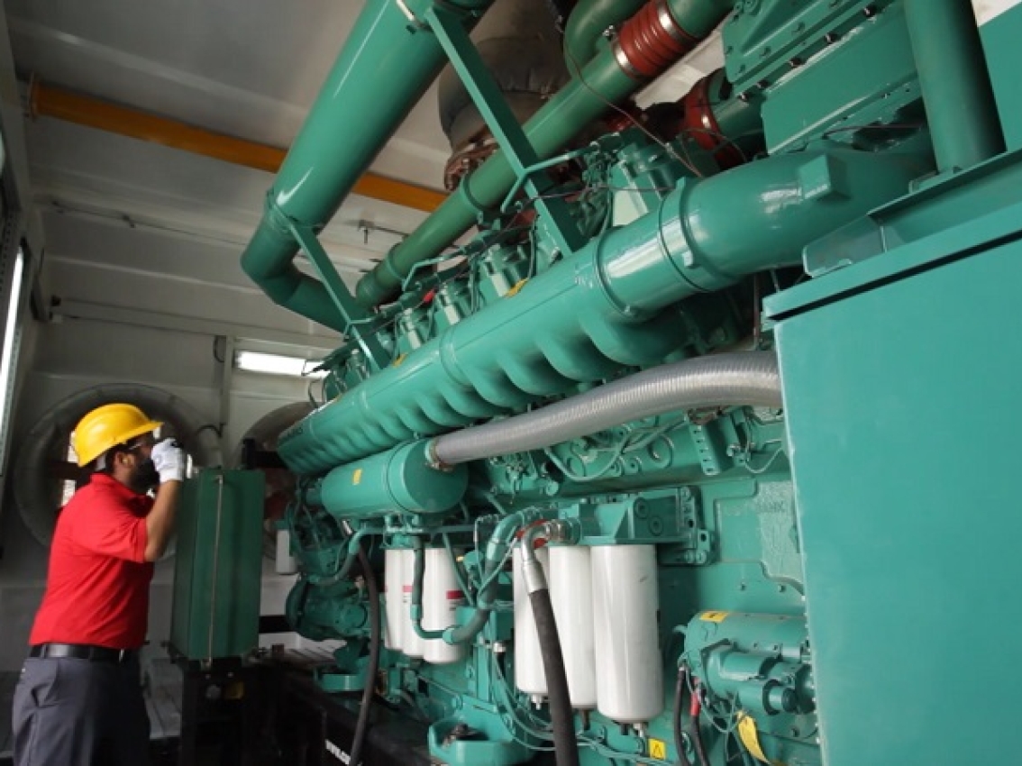 Man inspecting generator
