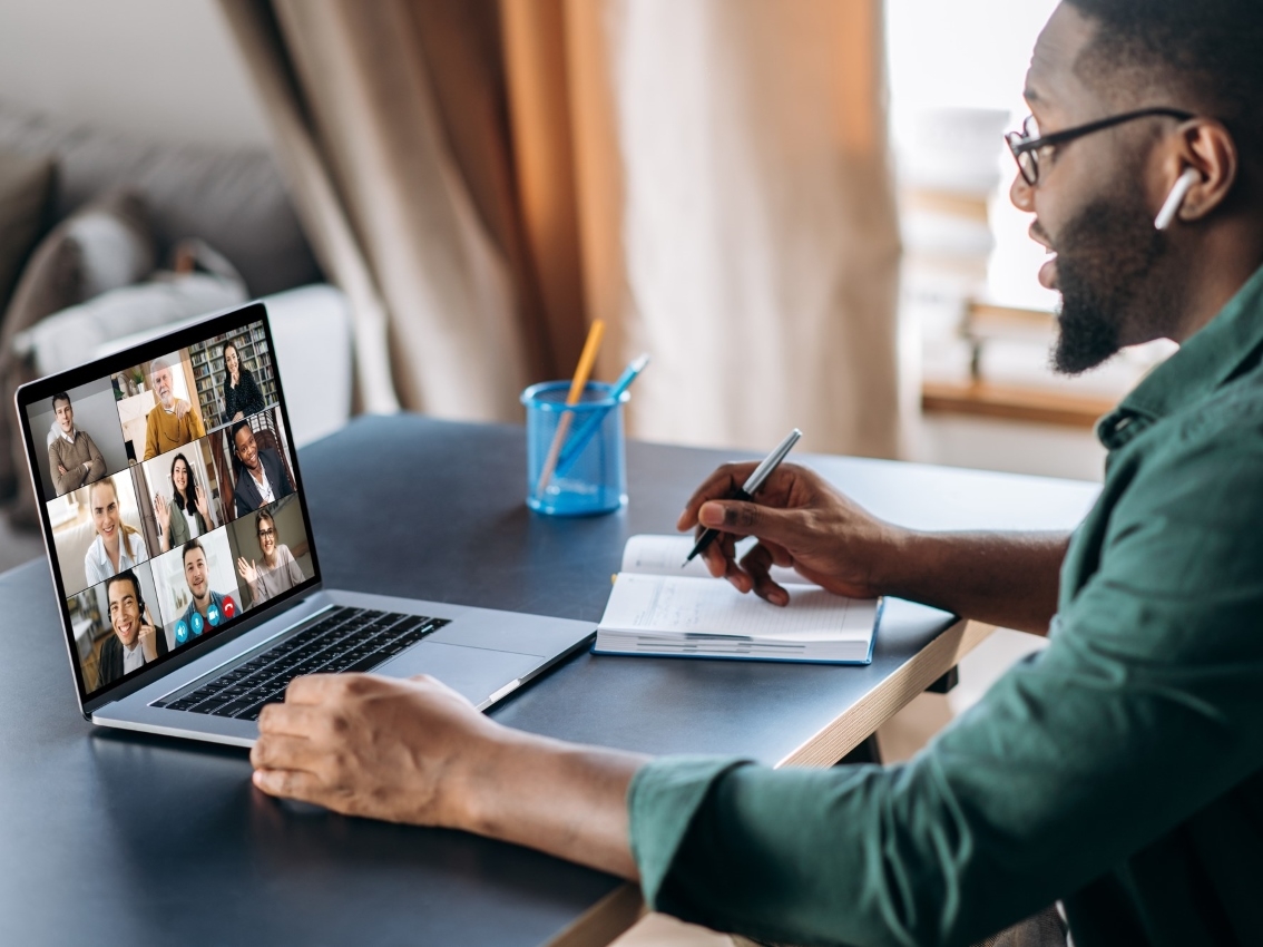 man on laptop on a conference call