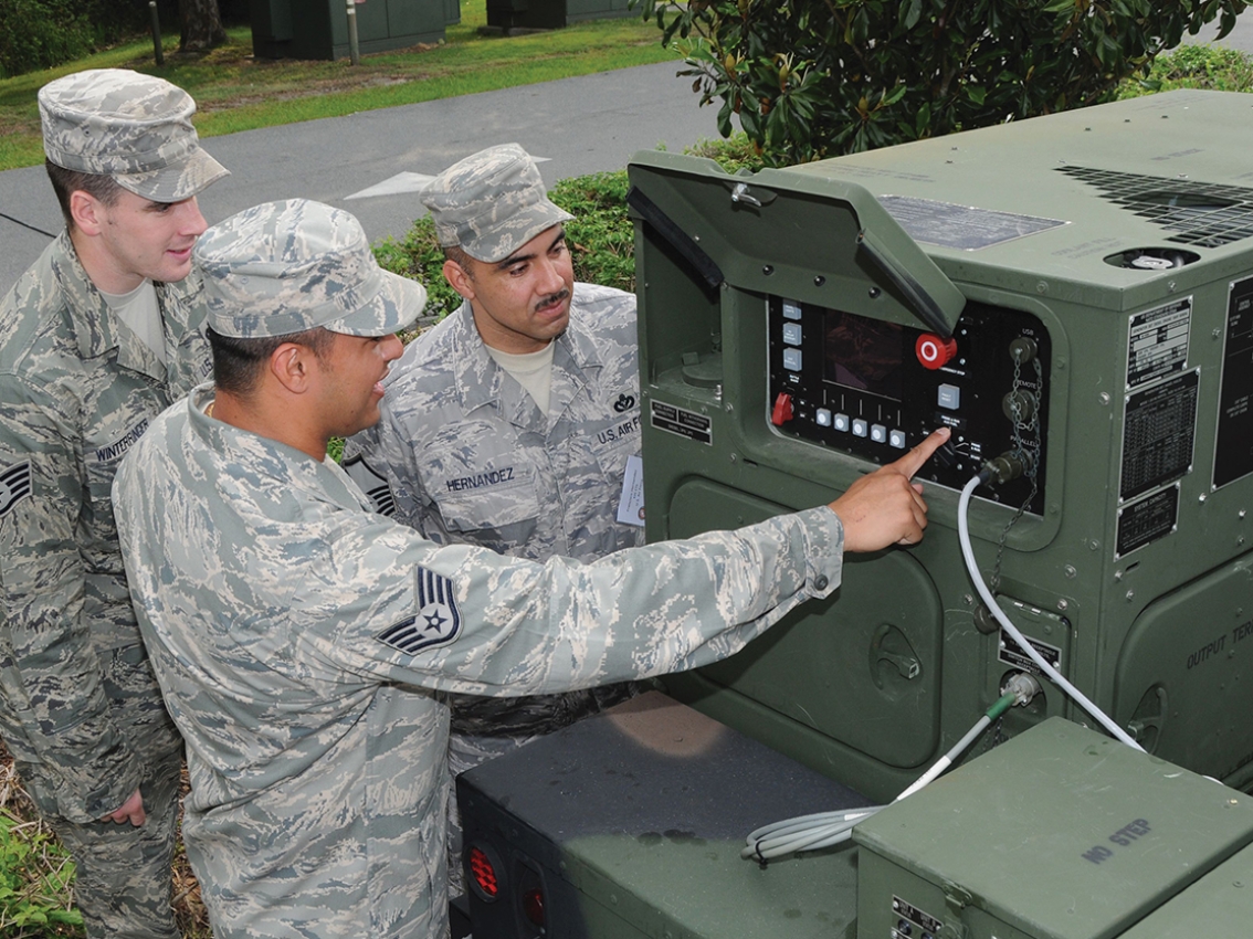 military personnel operating generator