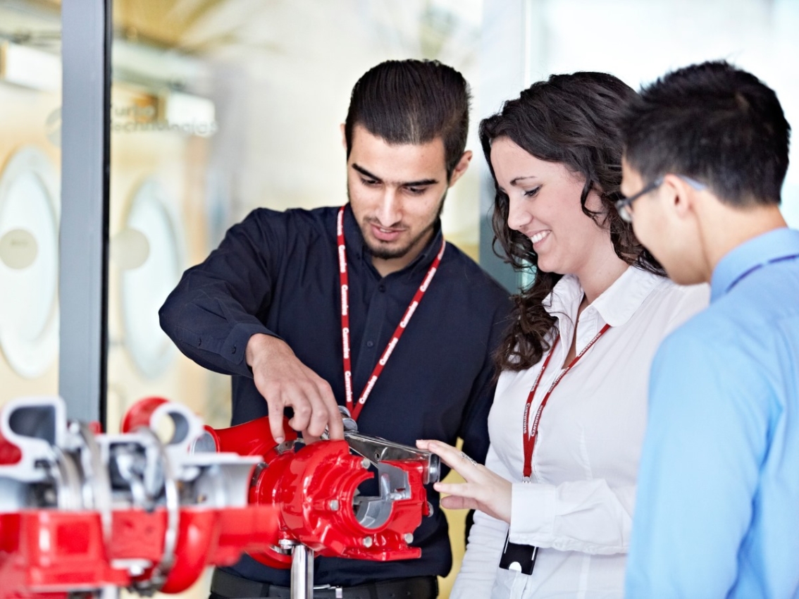 employees learning about engine technology