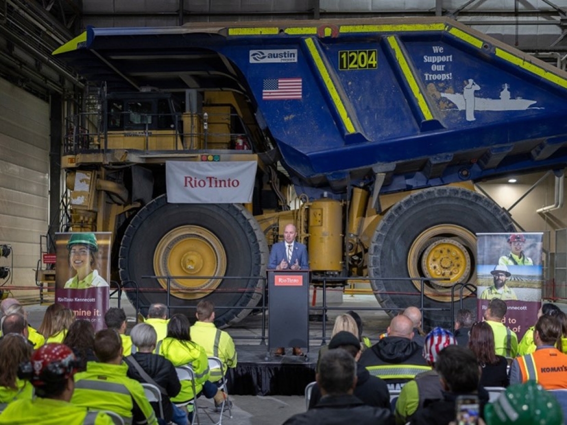 press conference with rio tinto truck in background