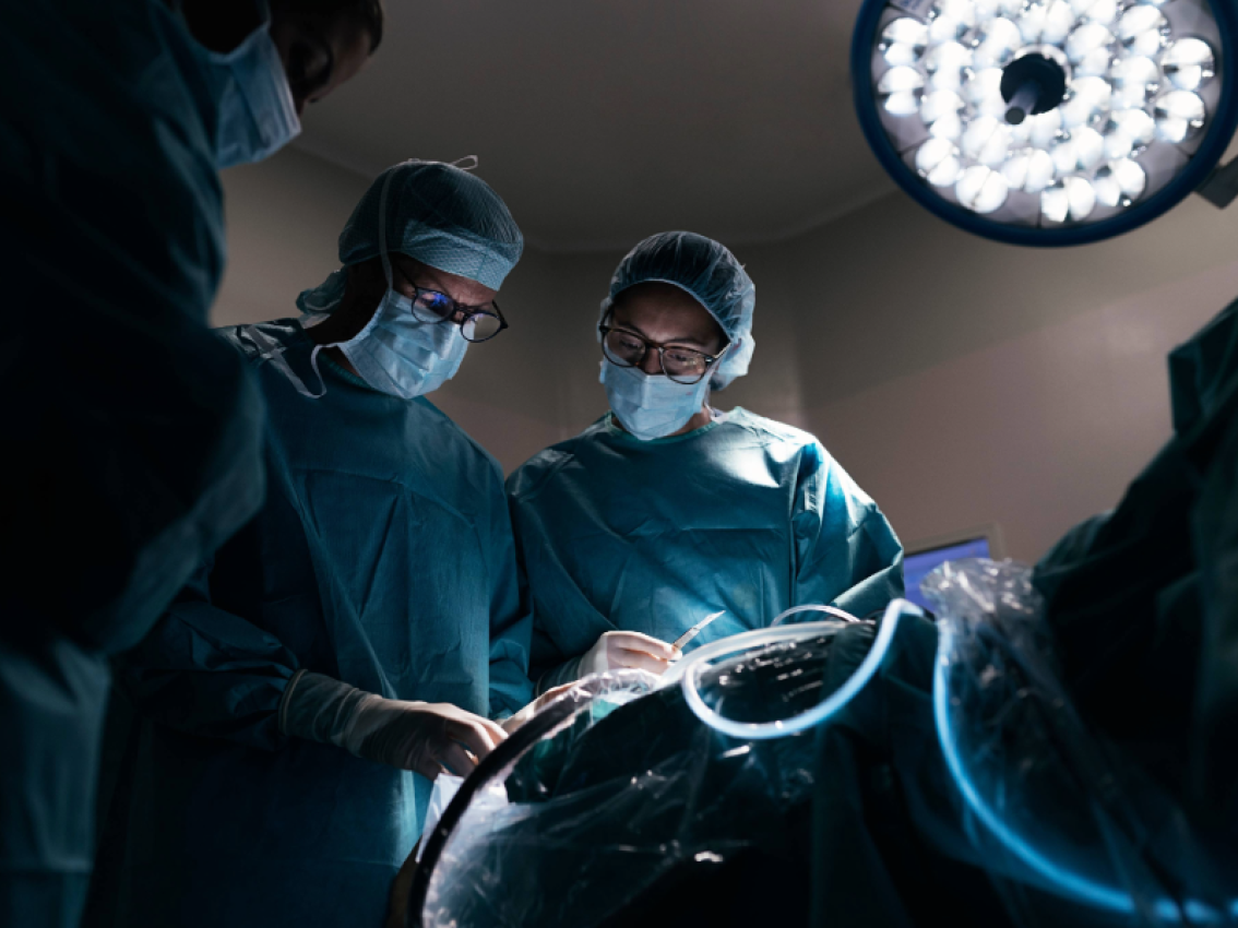 surgeons attending to patient