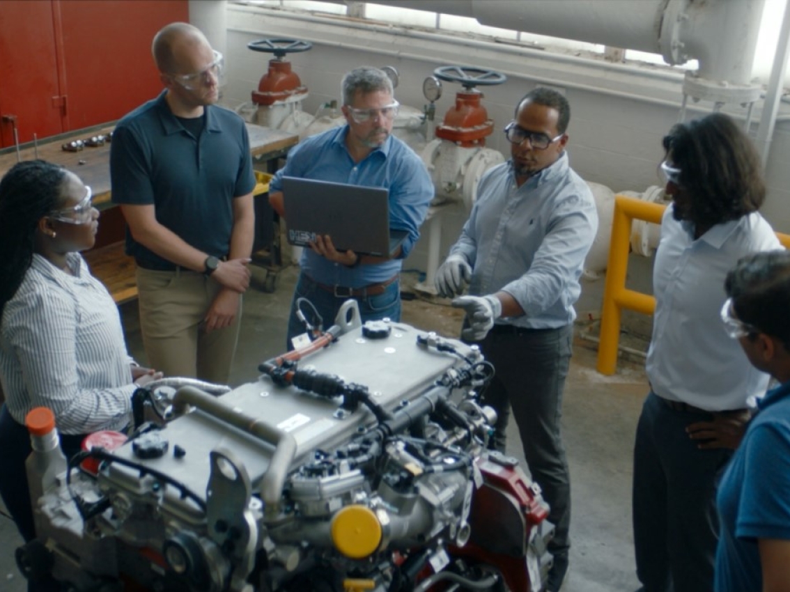 Team looking at X10 engine