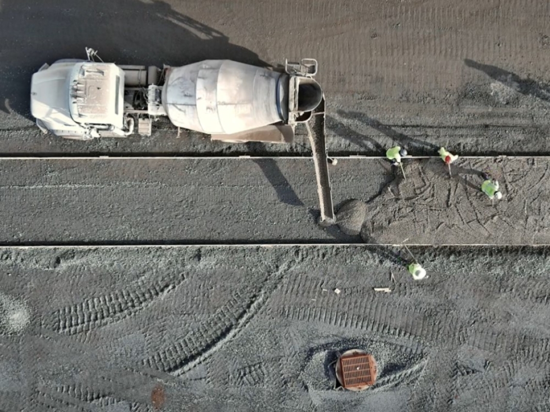 drone view of concrete truck on job site