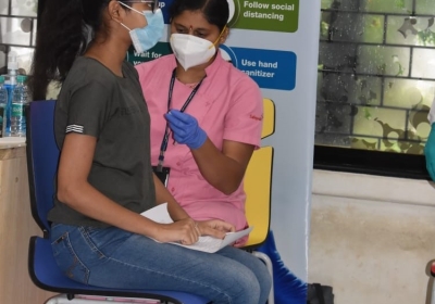 A COVID-19 vaccine shot is given
