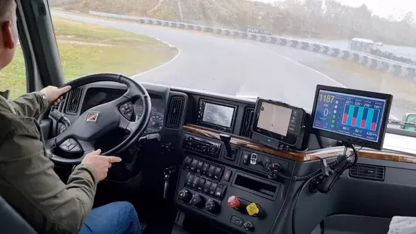 man driving truck with applications on dashboard