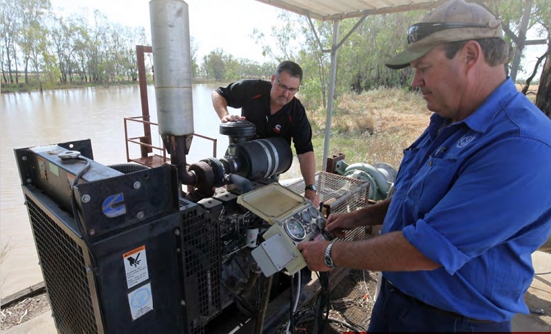 CSD Farms manager Mark Cathcart checks  the running hours on one of the oldest  Cummins powerpacks…over 10,000 hours.