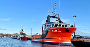 large vessel docked at pier side view