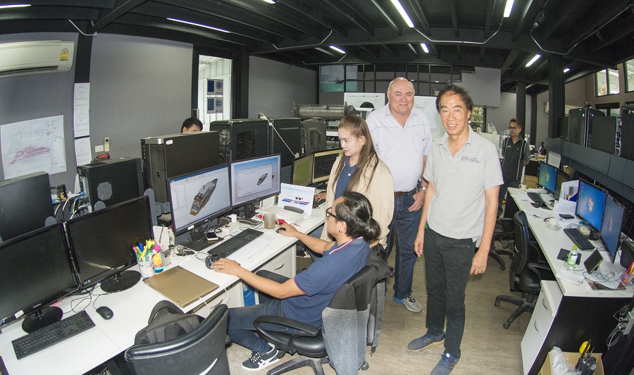 Managing Director Tavipol Hemangkorn on right, also Australian Project Mamager with design coordinator Khun Ah (standing) and draftsman Khun Chai at computer.