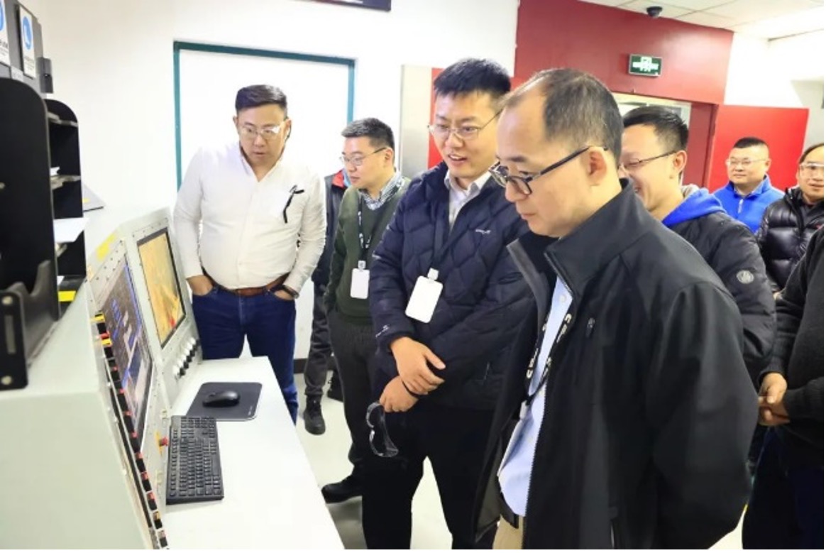 Employees visiting e-compressor test cell