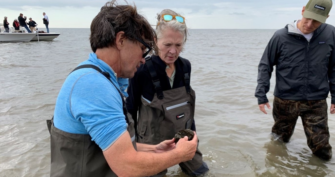 The Nature Conservancy’s Seth Blitch discusses the oyster reef project with Mary Chandler, Vice President – Community Relations and Corporate Responsibility, and Zach Gillen, General Manager -- Sales & Service North America.