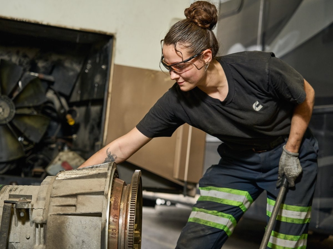 technician working on engine part